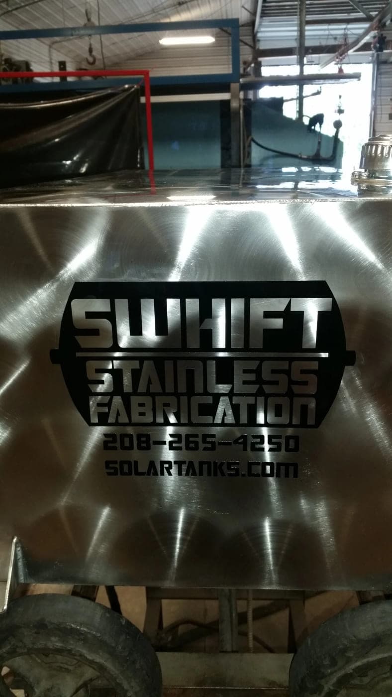 Swhift Stainless Fabrication logo and phone number applied to the side of a finished stainless steel tank
